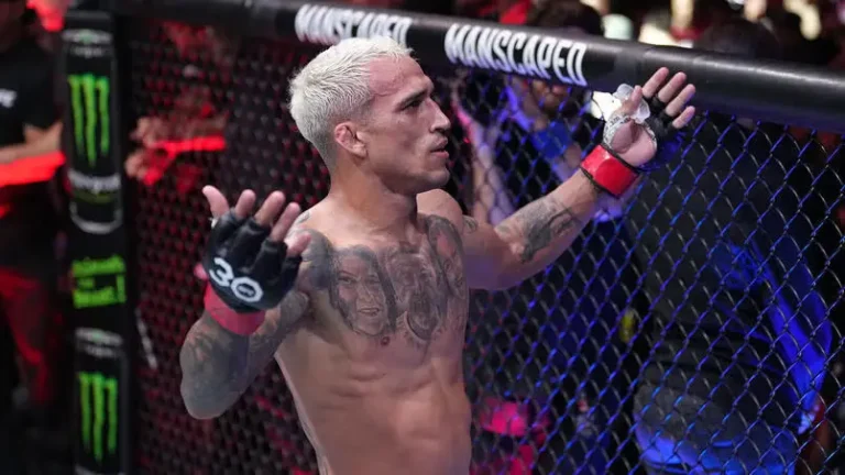 Charles Oliveira of Brazil celebrates his TKO victory over Beneil Dariush during the UFC 289 event at Rogers Arena.