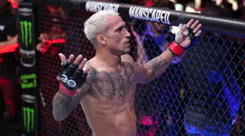 Charles Oliveira of Brazil celebrates his TKO victory over Beneil Dariush during the UFC 289 event at Rogers Arena.