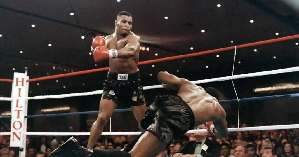 Mike Tyson knocks his opponent, heavyweight champion Trevor Berbick, to become the youngest heavyweight world champion in history on November 22, 1986 in Las Vegas.