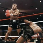 Mike Tyson knocks his opponent, heavyweight champion Trevor Berbick, to become the youngest heavyweight world champion in history on November 22, 1986 in Las Vegas.