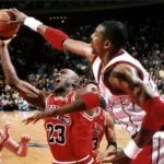 A blocked shot by Hakeem Olajuwon prevents Michael Jordan from taking to the air in a Rockets victory, January 19, 1997, at The Summit.