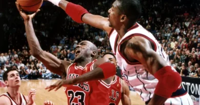 A blocked shot by Hakeem Olajuwon prevents Michael Jordan from taking to the air in a Rockets victory, January 19, 1997, at The Summit.