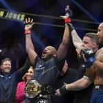 Jon Jones, center, celebrates after defeating Ciryl Gane in a UFC 285 mixed martial arts heavyweight title bout Saturday, March 4, 2023, in Las Vegas.