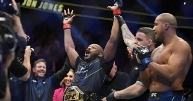 Jon Jones, center, celebrates after defeating Ciryl Gane in a UFC 285 mixed martial arts heavyweight title bout Saturday, March 4, 2023, in Las Vegas.
