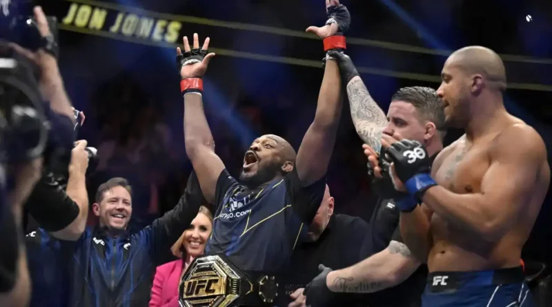 Jon Jones, center, celebrates after defeating Ciryl Gane in a UFC 285 mixed martial arts heavyweight title bout Saturday, March 4, 2023, in Las Vegas.
