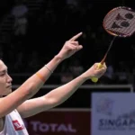 Kento Momota celebrates beating Indonesia's Anthony Sinisuka Ginting in their men's singles final match at the Singapore Open on Sunday in Singapore.