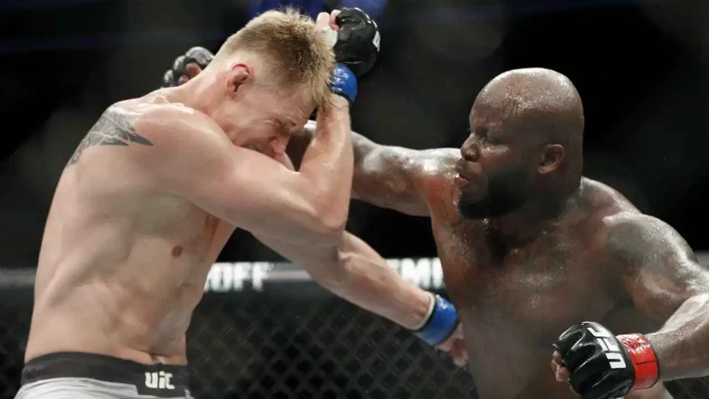 Derrick Lewis, right, punches Alexander Volkov during a heavyweight mixed martial arts bout.