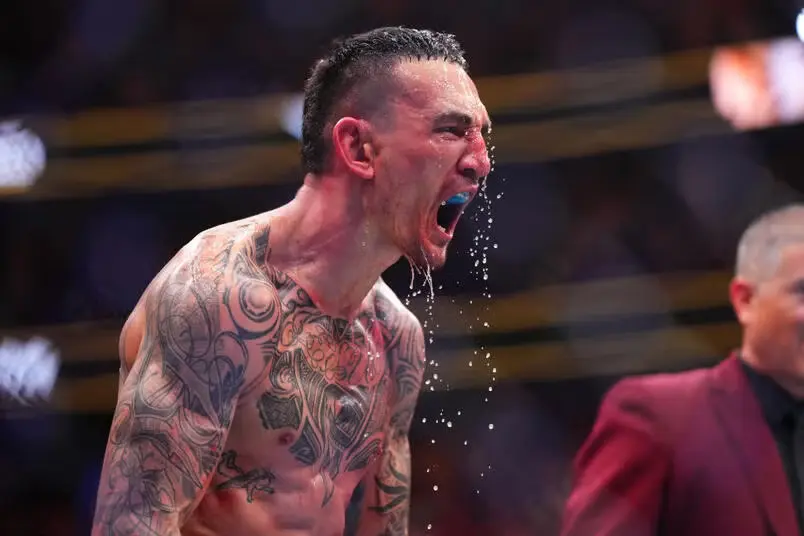 Max Holloway reacts to his knockout of Justin Gaethje in the BMF championship fight during the UFC 300 event at T-Mobile Arena on April 13, 2024 in Las Vegas, Nevada.