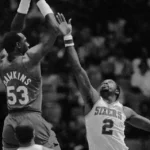 Moses Malone, right, defends Darryl Dawkins in this April 20, 1984, photo. Malone, an NBA Hall of Famer and three-time MVP, died Sunday at age 60. Two weeks ago, Dawkins died at 58.