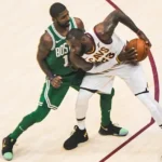 James protects the ball from Kyrie Irving in October 2017. The two were teammates in Cleveland for three seasons.
