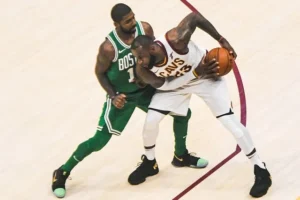 James protects the ball from Kyrie Irving in October 2017. The two were teammates in Cleveland for three seasons.