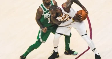 James protects the ball from Kyrie Irving in October 2017. The two were teammates in Cleveland for three seasons.