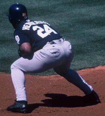 Rickey Henderson crouching at first for the San Diego Padres