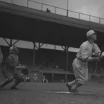 Baseball player Sam Crawford after hitting a ball, Los Angeles, circa 1920 (cropped).