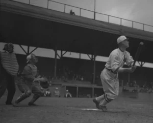 Baseball player Sam Crawford after hitting a ball, Los Angeles, circa 1920 (cropped).