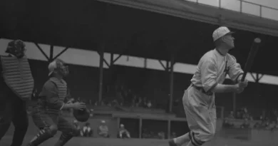 Baseball player Sam Crawford after hitting a ball, Los Angeles, circa 1920 (cropped).