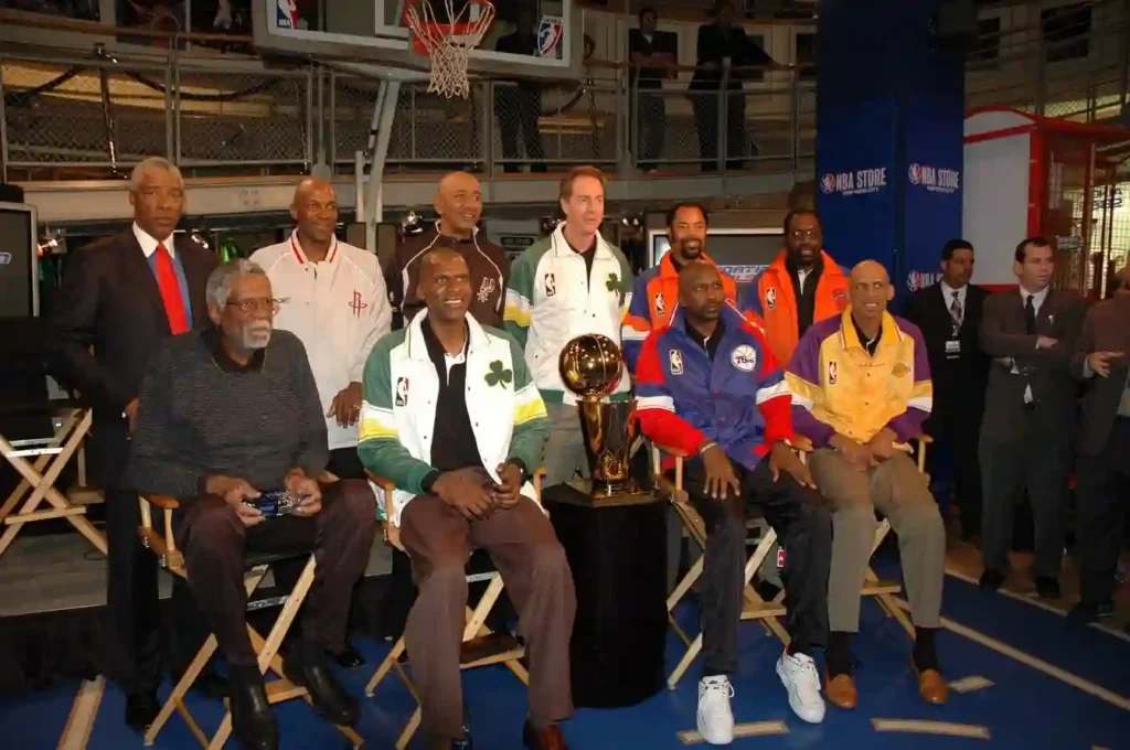 (Top) NBA legends Julius "Dr. J" Erving, Clyde Drexler, George Gervin, Dave Cowens, Walt "Clyde" Frazier, Earl Monroe, (Bottom) Bill Russell, Robert Parish, Moses Malone & Kareem Abdul-Jabbar pose w/ the Larry O'Brien NBA Championship Trophy in 2005.