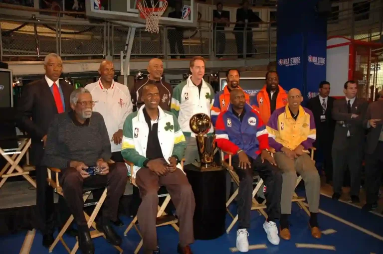(Top) NBA legends Julius "Dr. J" Erving, Clyde Drexler, George Gervin, Dave Cowens, Walt "Clyde" Frazier, Earl Monroe, (Bottom) Bill Russell, Robert Parish, Moses Malone & Kareem Abdul-Jabbar pose w/ the Larry O'Brien NBA Championship Trophy in 2005.